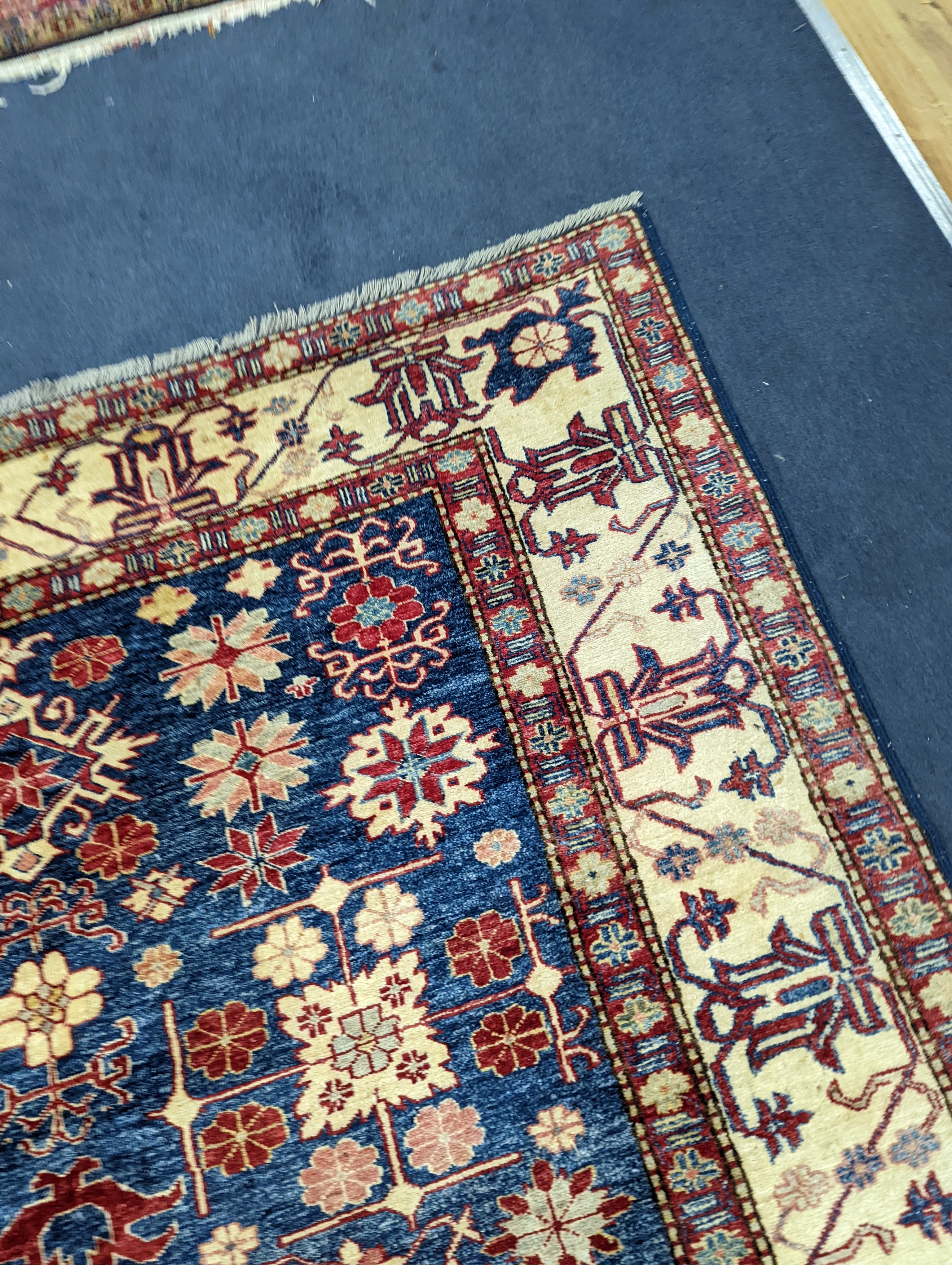 A Kazak blue ground carpet, 242 x 186cm